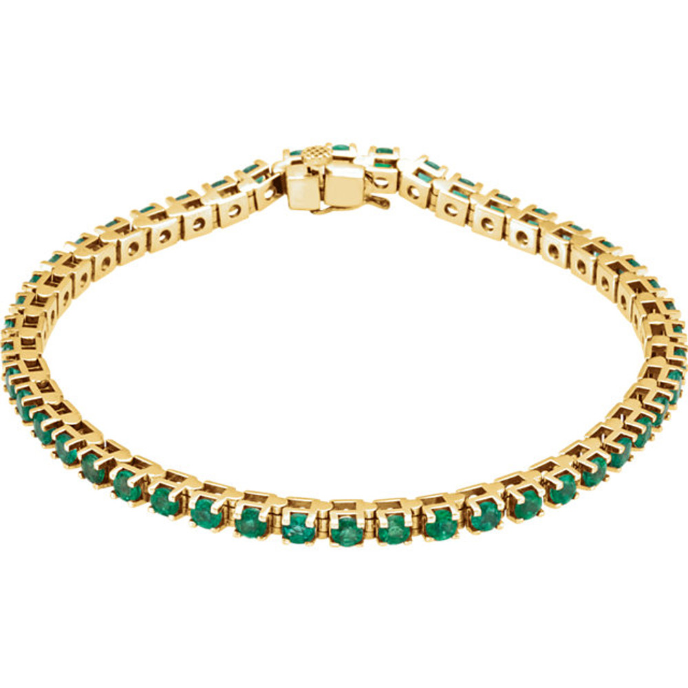 A dazzling complement to any style, this classic gemstone 7" bracelet showcases 46 vibrant round shaped emeralds in 14k yellow gold.