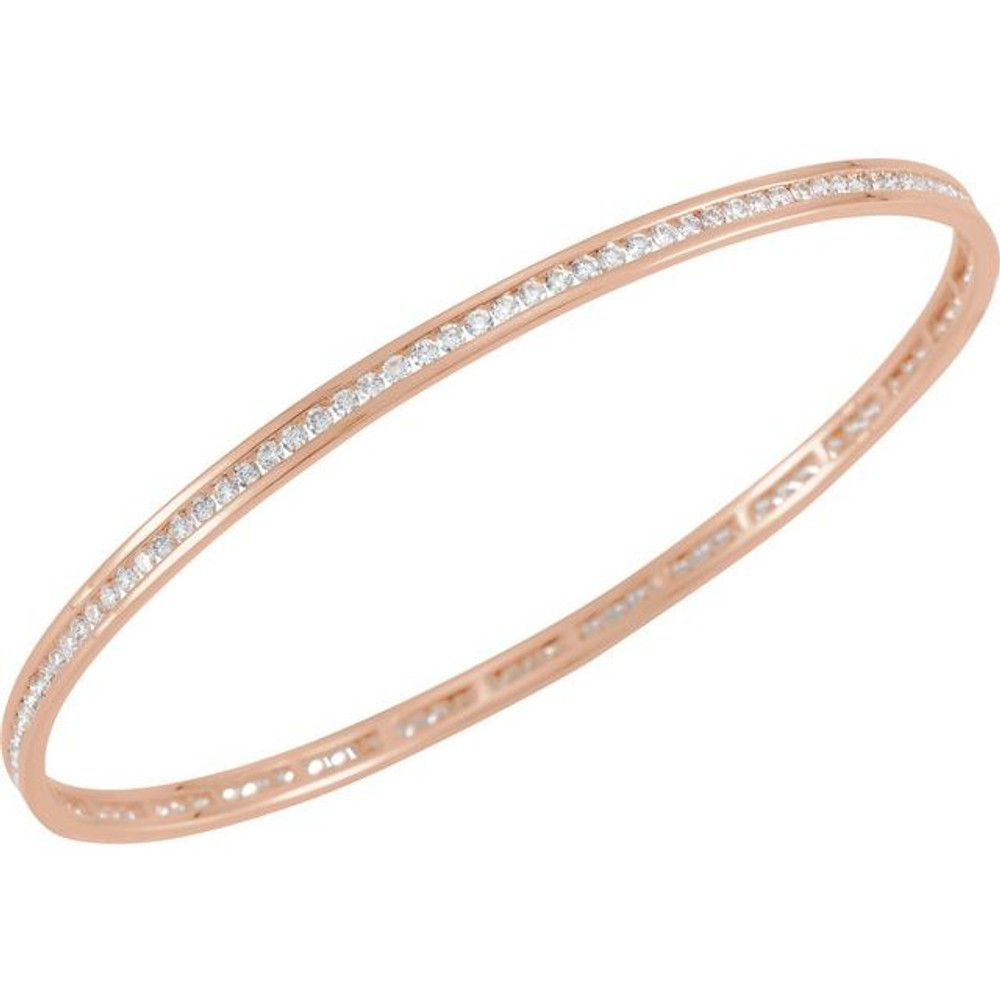 Elegant 14Kt rose gold diamond stackable bangle 7.5" bracelet featuring a sparkling display of white round diamonds. Total weight of the diamonds is 2 1/4cts. Total weight of the gold is 8.99 grams.