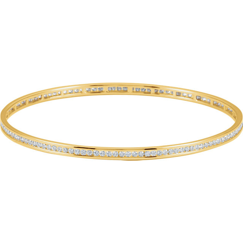 Elegant 14Kt yellow gold diamond stackable bangle 7.5" bracelet featuring a sparkling display of white round diamonds. Total weight of the diamonds is 2 1/4cts. Total weight of the gold is 8.99 grams.