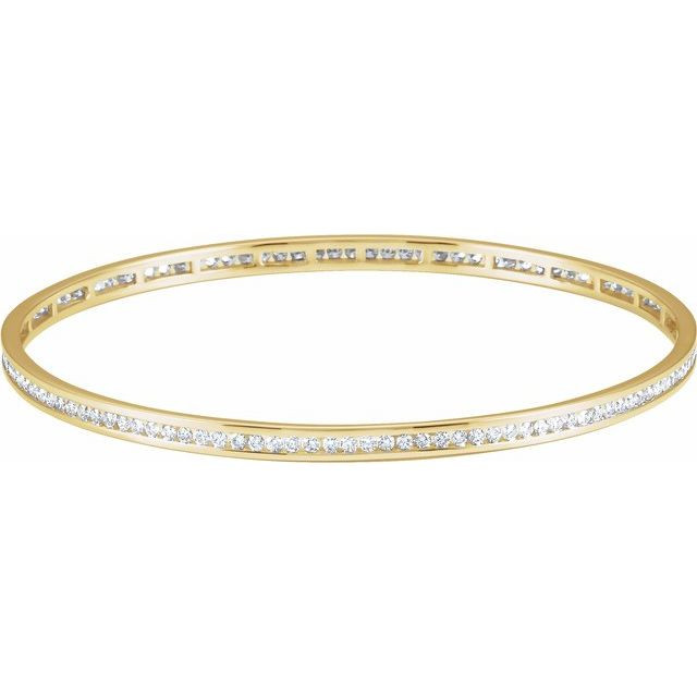 Elegant 14Kt yellow gold diamond stackable bangle 7.5" bracelet featuring a sparkling display of white round diamonds. Total weight of the diamonds is 2 1/4cts. Total weight of the gold is 8.99 grams.