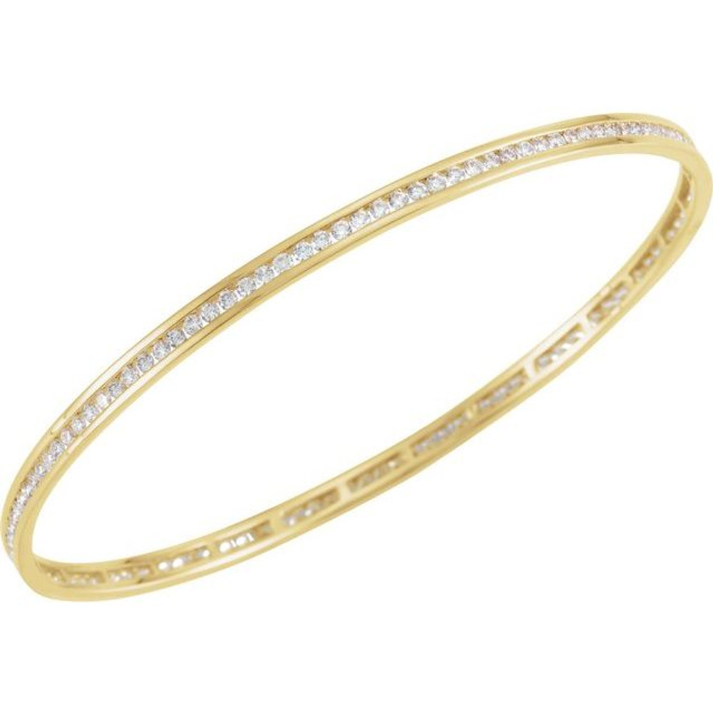 Elegant 14Kt yellow gold diamond stackable bangle 7.5" bracelet featuring a sparkling display of white round diamonds. Total weight of the diamonds is 2 1/4cts. Total weight of the gold is 8.99 grams.