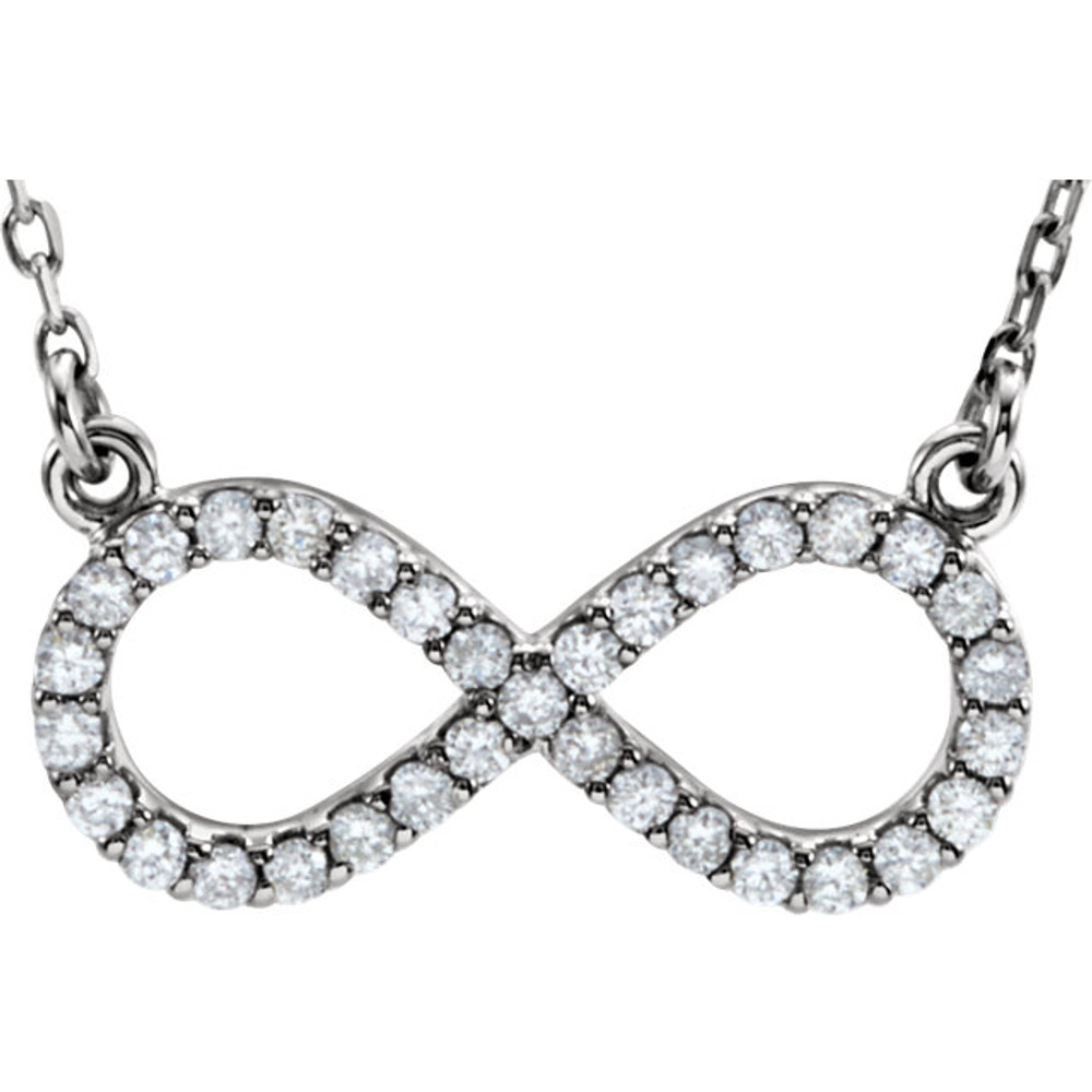 This modern 14k white gold necklace features a sparking diamond studded infinity symbol. Diamonds are G-H in color, and I1 or better in clarity. Infinity charm is 16.25mm across and is presented on an 16 inch 14k white gold diamond cut cable chain.