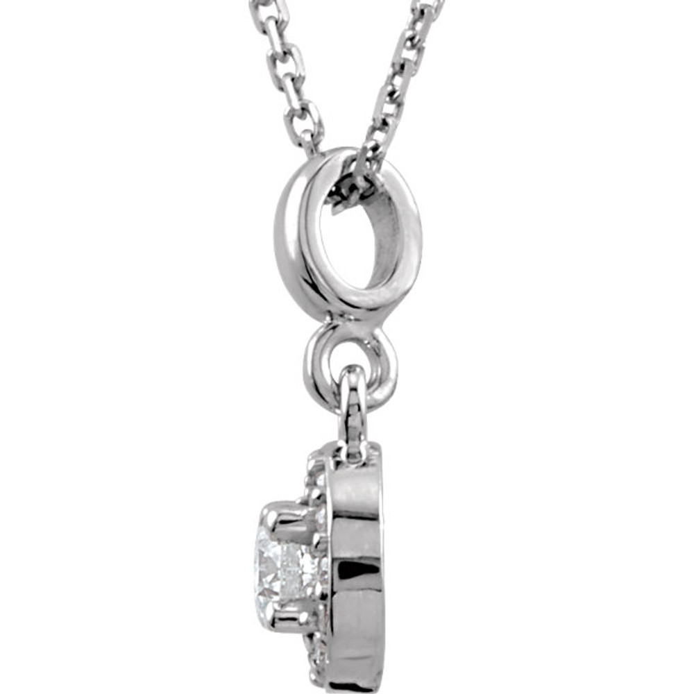If you want to make a real entrance, don this dramatic diamond pendant necklace. All eyes will be on you and your jeweled d'colletage. You will be instantly transfixed into the one they all want to know even if they are not the actual guest of honor. Set in 14K white gold, this pendant weighs 1/5 ct. tw. and has a bright polish to shine.