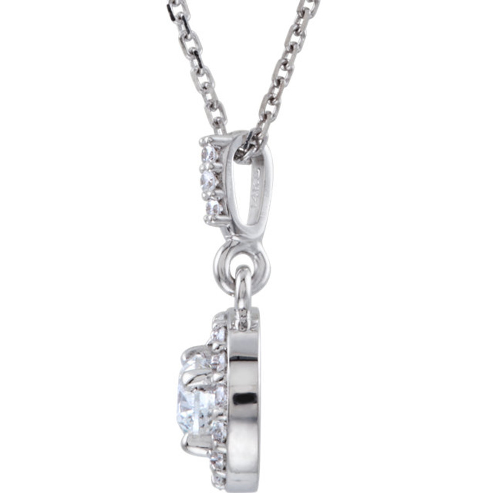 14 karat white gold diamond necklace featuring shimmering white diamonds which articulate beautifully. The total carat weight of white diamonds is 1/2 carat.