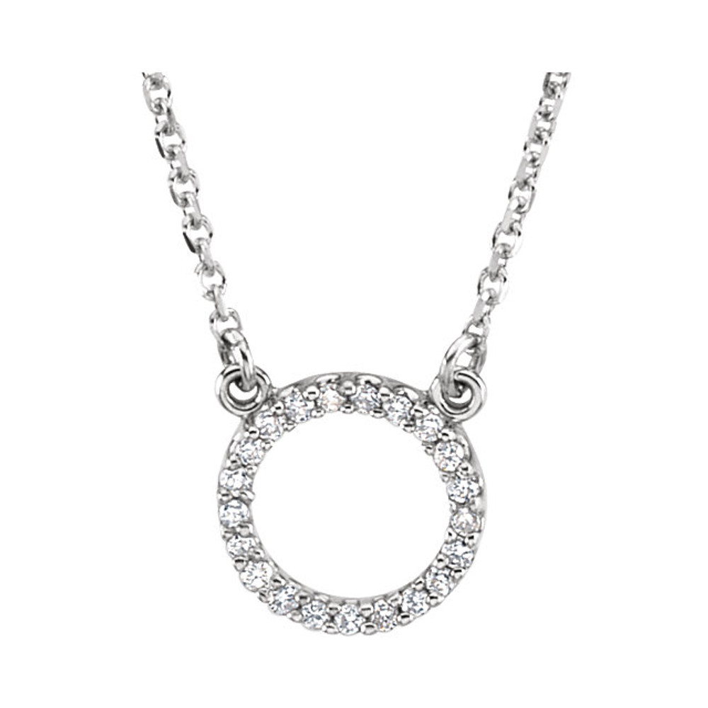 This necklace features a dazzling assortment of round diamonds set in a circle of 14K white gold. Comes with an 16.5 Inch necklace. The total diamond weight is 1/10 ct . A very fine piece of jewelry. 