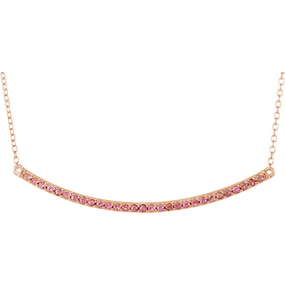 Beautiful 14k rose gold pink sapphire bar necklace hanging from a 16-18" inch chain which is included. Polished to a brilliant shine.