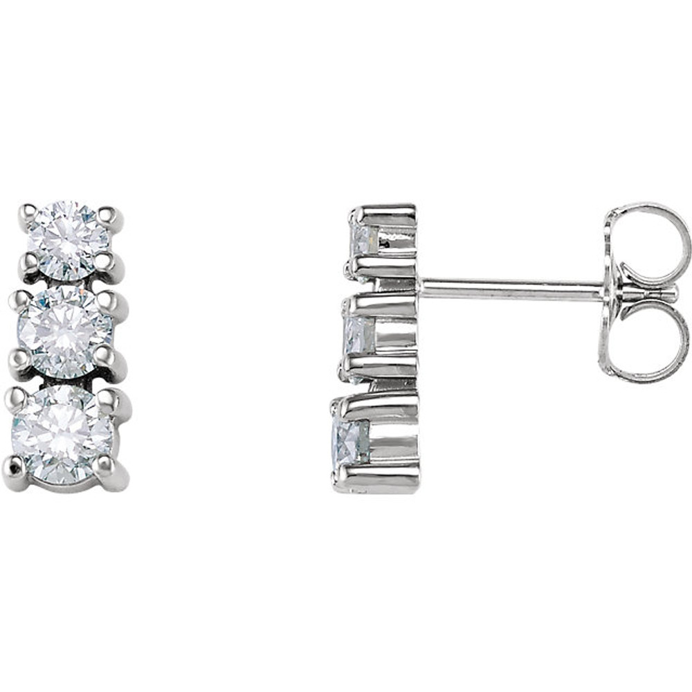 Bold and brilliant, these diamond 3 stone earrings are a sparkling look, perfect for that special evening out. Crafted in cool 14K white gold, each earring features three shimmering prong-set diamonds that are G-H in color and I1 or better in clarity. Radiant with 1/4 ct. t.w. of diamonds and polished to a brilliant shine, these post earrings secure comfortably with friction backs.