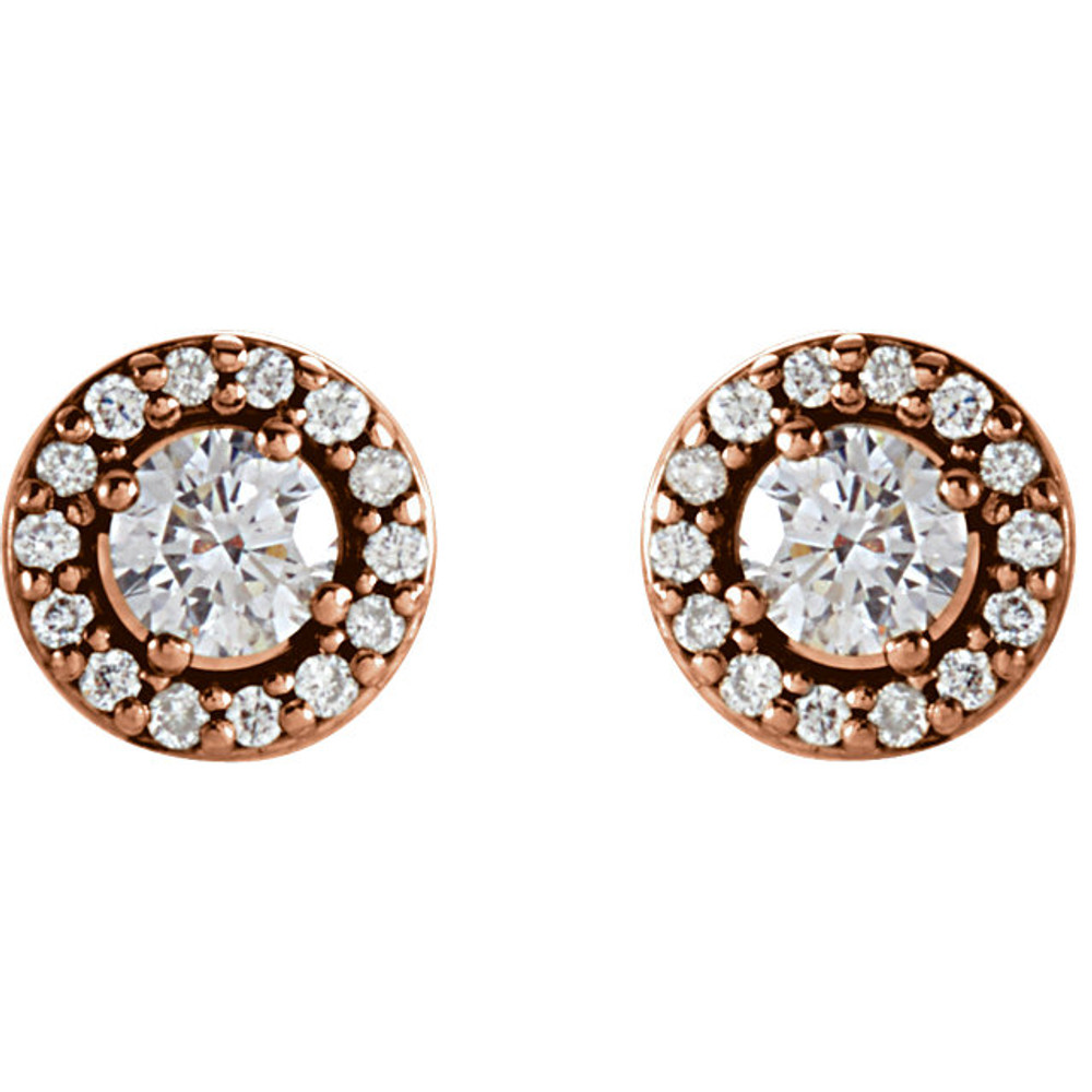 A classic pair of diamond halo earrings featuring 2 center round brilliant diamonds along with 28 sparkling white round side diamonds weighing . 0.25 carats! A beautifully styled setting crafted in 14K rose gold. A great size for everyday wear with brilliant sparkle and no visible inclusions. The center diamonds grade with Color G-H, Clarity I1 while the side diamonds grade with an color G-H, clarity I1. The earrings present a spectacular value and offer a big, fiery look. A very good value for big diamonds in a halo setting. A must have style!