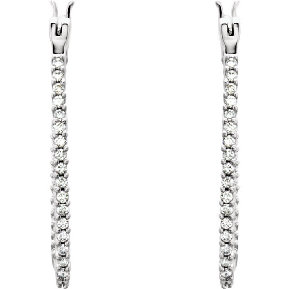 Superb style is found in these 14Kt white gold hoop earrings accented with the brilliance of round full cut diamonds. Total weight of the diamonds is 1.00 carat.
