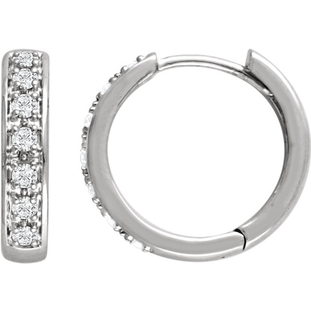 The classic hoop earring has been given a dazzling update. Fashioned in cool 14K white gold, these huggie hoop earrings sparkle with a row of shimmering round diamonds aligned down the front. A great look with any attire, these hoops captivate with 1/3 ct. t.w. of diamonds and a bright polished shine. The hoops secure with hinged backs. 