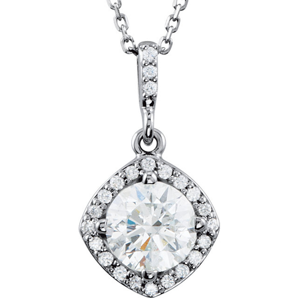 An impressive round diamond framed in additional round diamonds is the focal point of this extraordinary necklace for her. The pendant, fashioned in 14K white gold, is suspended from an 18-inch chain secured with a spring ring clasp. The total diamond weight is 1 1/6 carats.