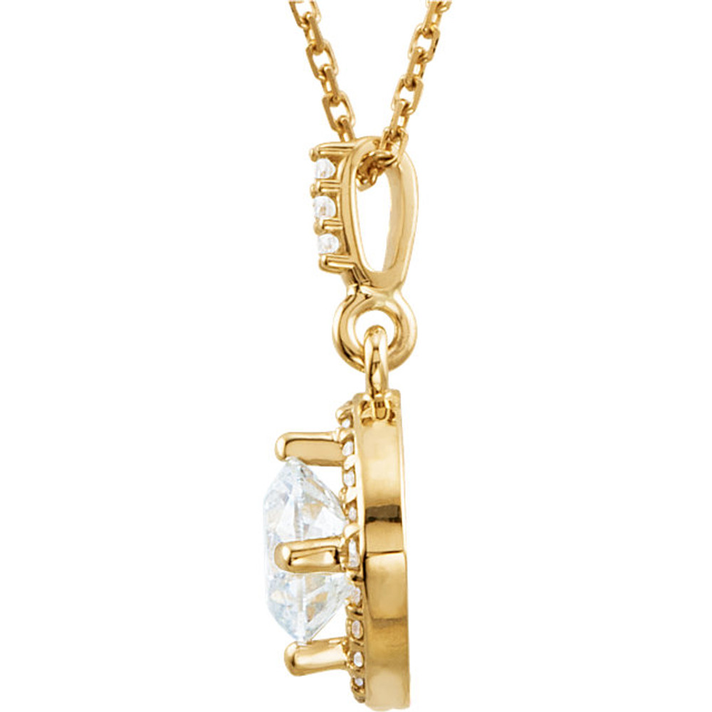 An impressive round diamond framed in additional round diamonds is the focal point of this extraordinary necklace for her. The pendant, fashioned in 14K yellow gold, is suspended from an 18-inch chain secured with a spring ring clasp. The total diamond weight is 7/8 carats.