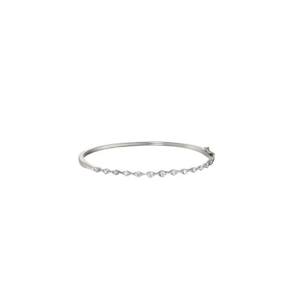 Wonderful modern style is found in this 14Kt white gold stackable diamond bracelet featuring a total carat weight of 1.00 carat. 