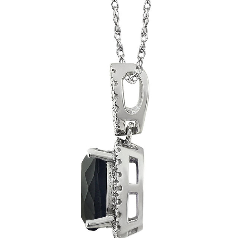 Exquisite 14Kt white gold pendant captures the beauty of a genuine 9.00mm cushion cut Onyx accented by white shimmering diamonds hanging from an 18" inch chain. Total weight of the diamonds is 0.03 total carat weight.