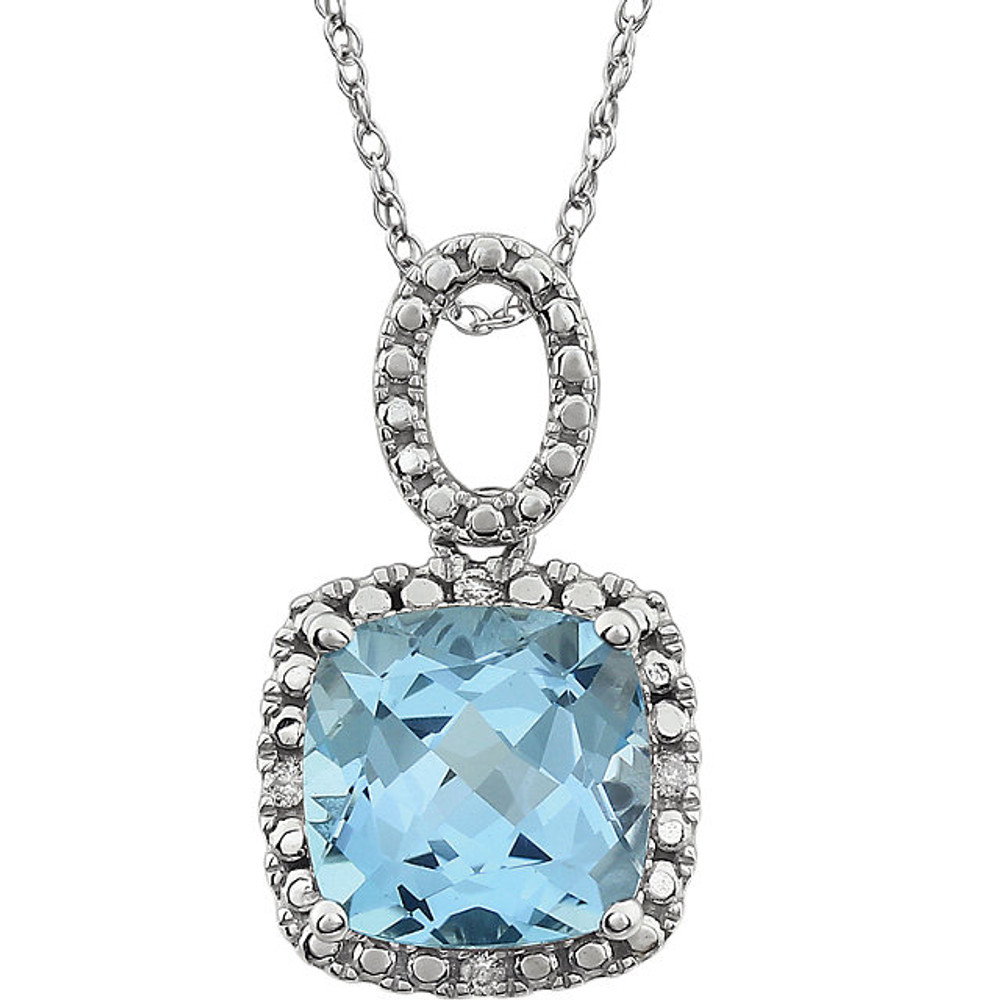 Exquisite 14Kt white gold pendant captures the beauty of a genuine 9.00mm cushion cut Sky Blue Topaz accented by white shimmering diamonds hanging from an 18" inch chain. Total weight of the diamonds is 0.03 total carat weight.