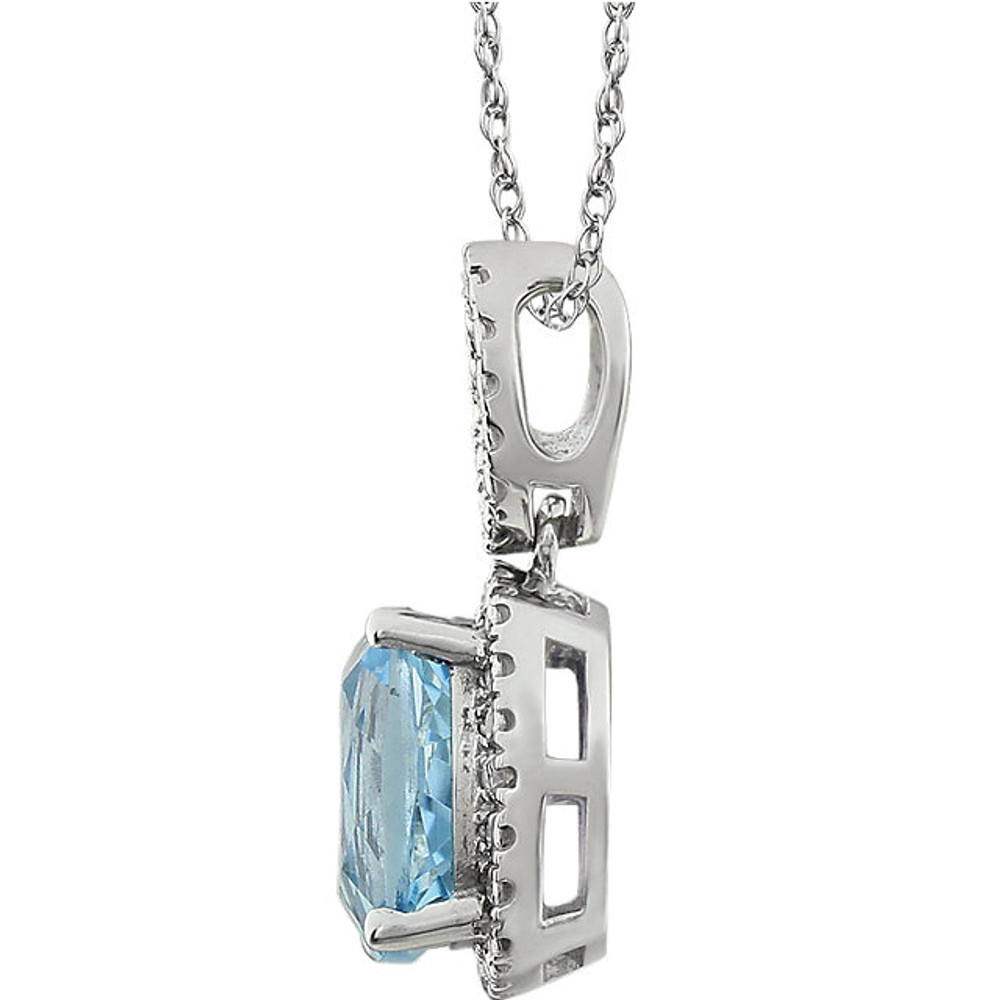 Exquisite 14Kt white gold pendant captures the beauty of a genuine 9.00mm cushion cut Sky Blue Topaz accented by white shimmering diamonds hanging from an 18" inch chain. Total weight of the diamonds is 0.03 total carat weight.