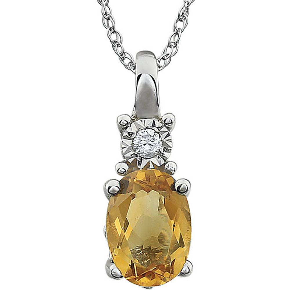 Exquisite 14Kt white gold pendant captures the beauty of a genuine 7x5mm oval Citrine accented by white shimmering diamonds hanging from an 18" inch necklace.Total weight of the diamonds is 0.02 total carat weight.