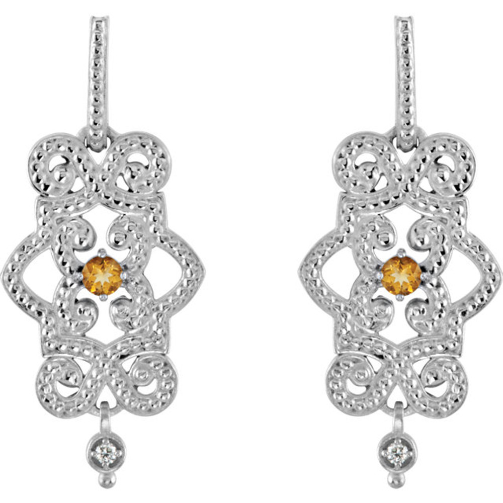 Wonderful 14Kt white gold dangle earrings with genuine citrine and full cut diamonds. Diamonds are G-H in color and I1 or better in clarity. Polished to a brilliant shine.