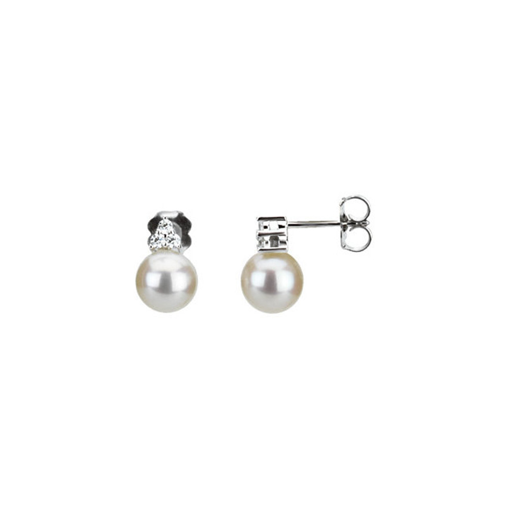 These elegant 14k white gold earrings each feature a white freshwater cultured pearl with diamond accents. Diamonds are 1/8ctw, G-H in color, and I1 or better in clarity. Polished to a brilliant shine.