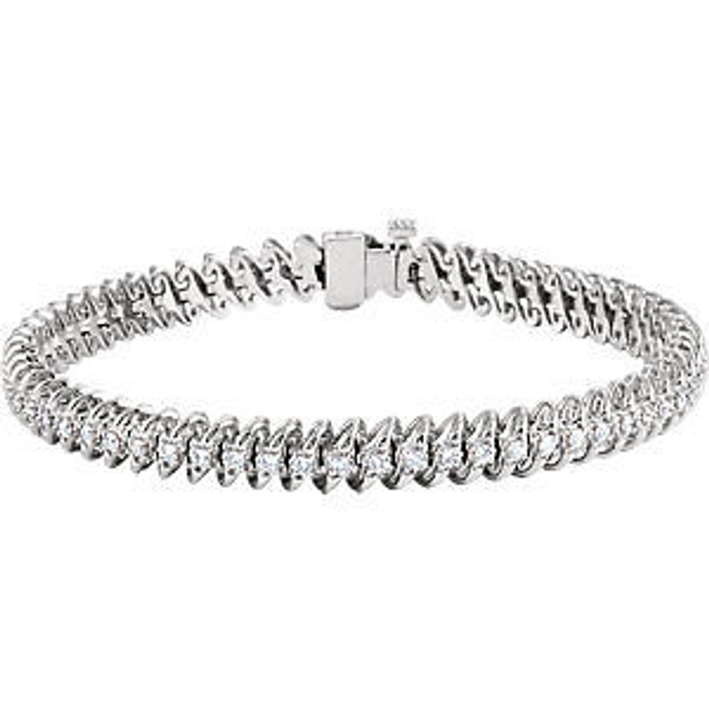 Sparkling, brilliant cut diamonds are set in a classic 14k white gold, four-prong tennis bracelet.