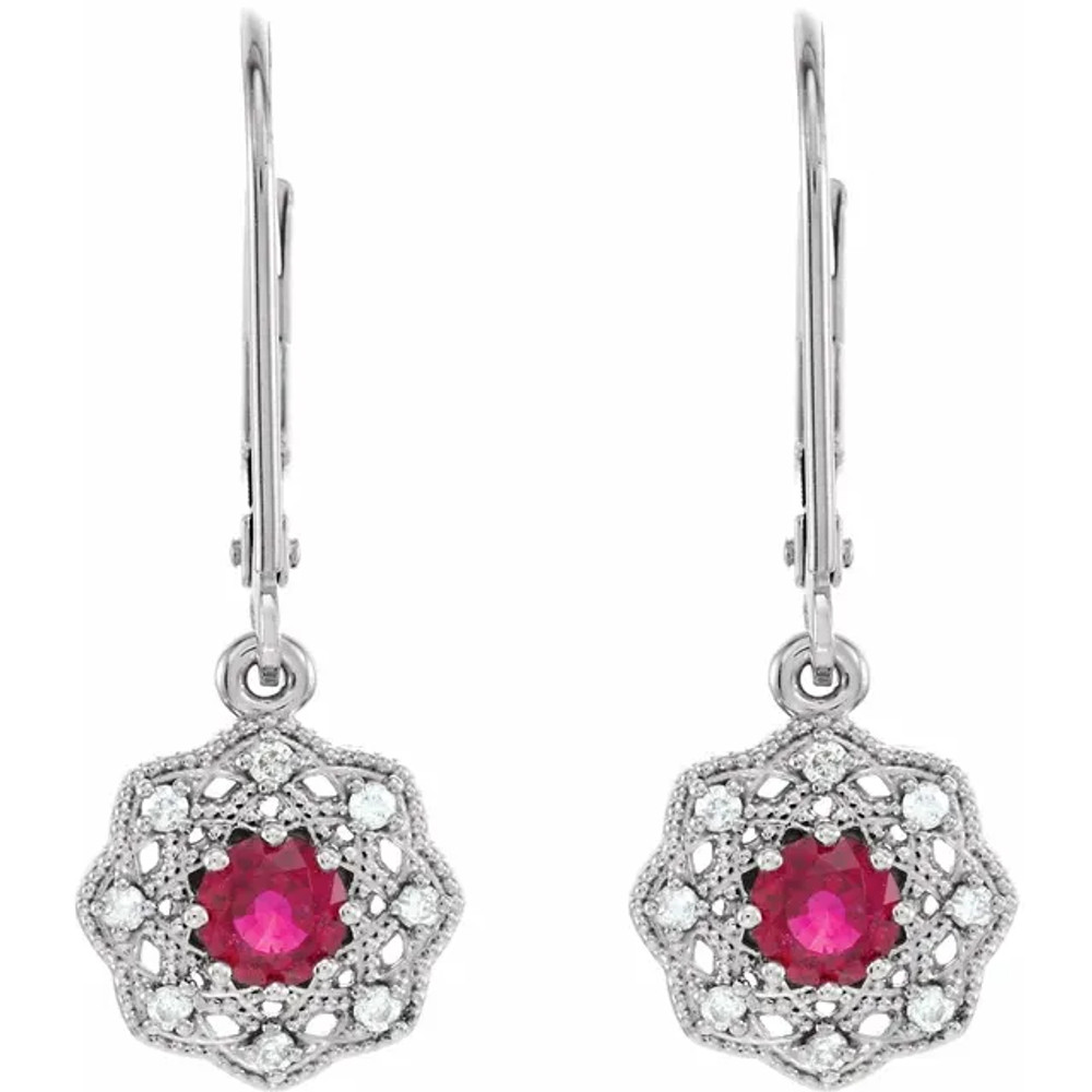 You'll feel like royalty in these breathtaking genuine ruby drop earrings, enhanced by 1/8 ct. t.w. diamonds and a 14K white gold setting.