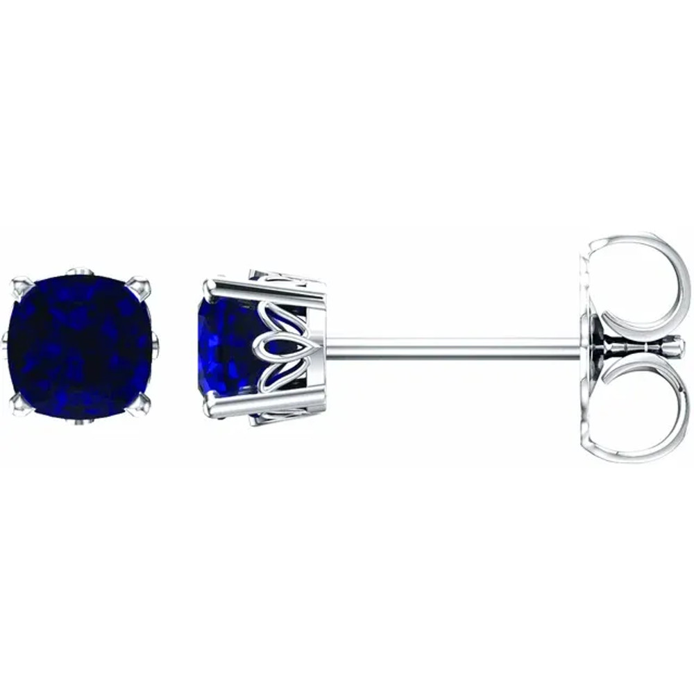 Sapphires prized for their intense velvety color and the calming influence of blue has made it an enduring symbol for loyalty and trust, which also makes it the perfect gift to represent a faithful and steadfast commitment. This simple stud design features a 6 x 6mm cushion-lab grown blue sapphire cradled in a 4-prong basket of 14k white gold finished with a friction back post.