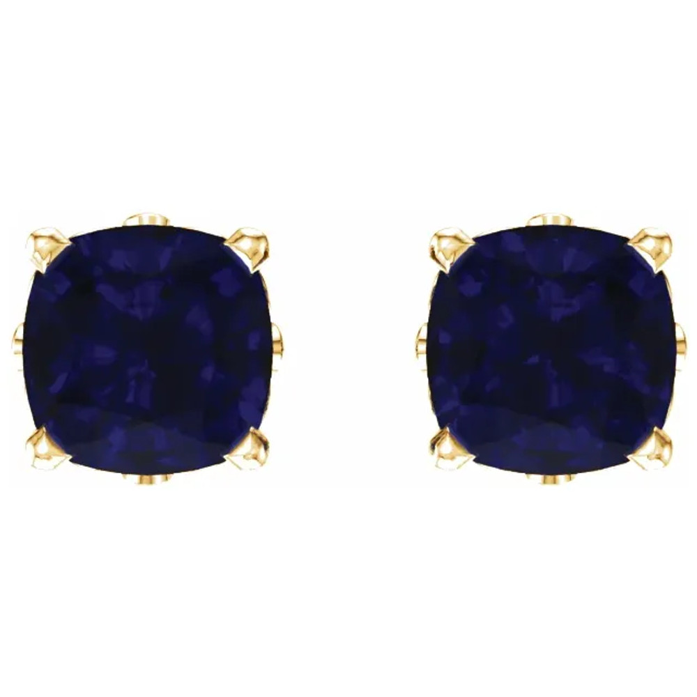 Deeply rich in color, these blue sapphire earrings are complemented by 14k yellow gold four-prong settings and make a simply striking gift.