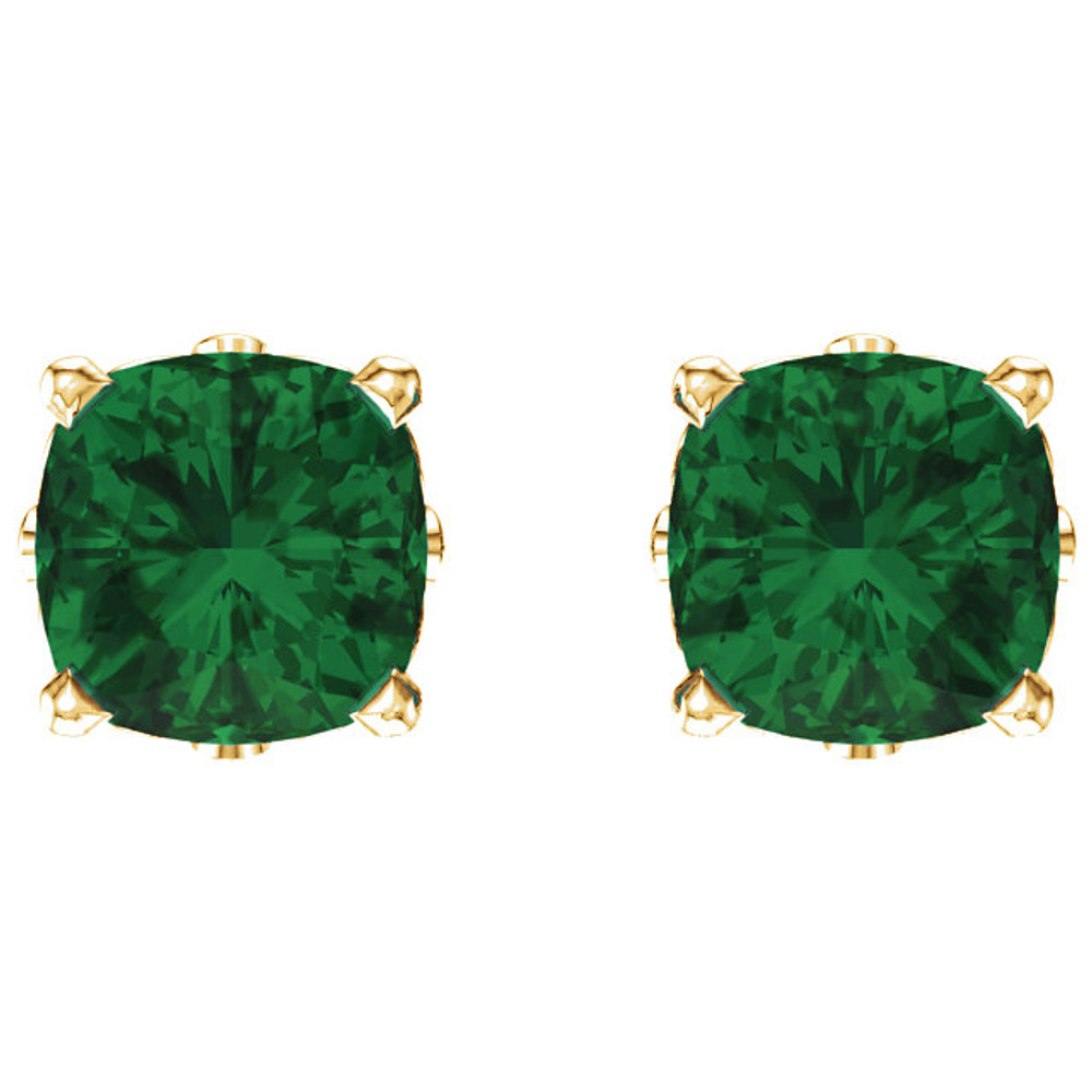 Delicate in design, these petite emerald stud earrings feature a pair of hand-selected green emeralds complemented by 14k yellow gold four-prong settings.