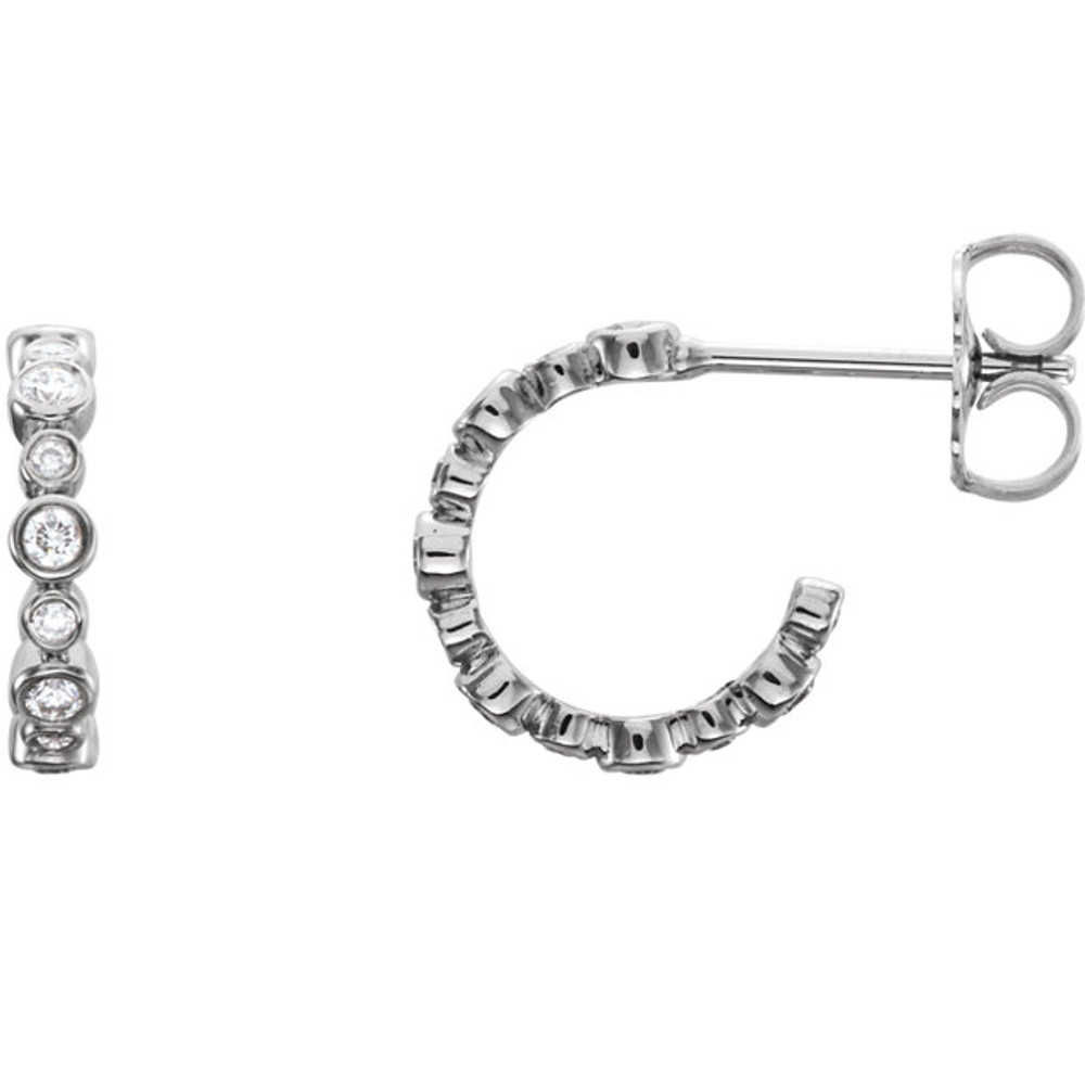 In each 14k White Gold J-Hoop Earring, twelve diamonds are bezel set. Earrings are finished with friction backs for pierced ears. Each earring has roughly .125 carats, for a total diamond weight of 1/4 carats.