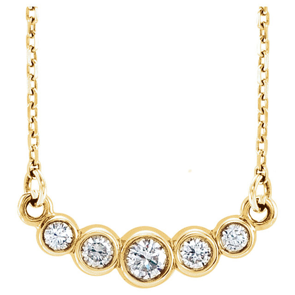 Beautiful 14Kt yellow gold graduated bezel set 1/5 ct. tw. diamond necklace hanging from a 16-18" inch chain which is included.