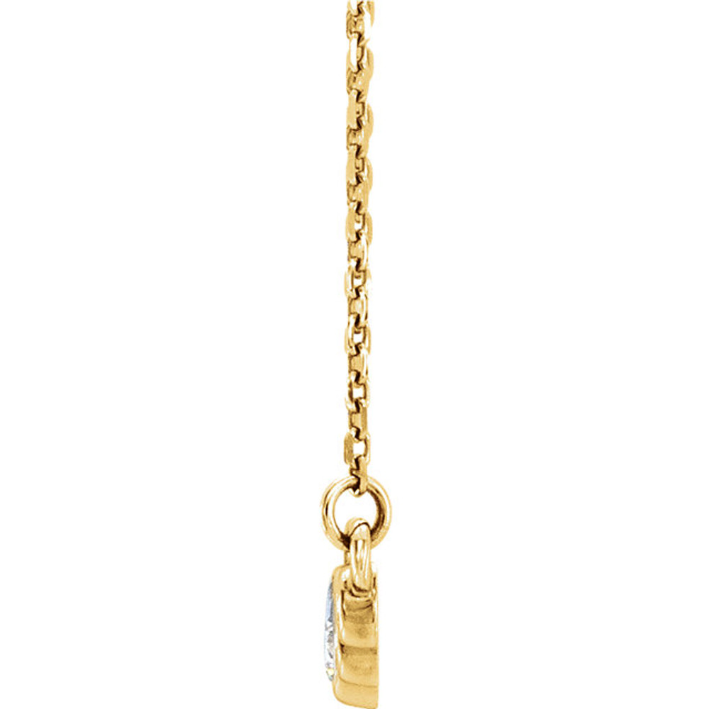 Beautiful 14Kt yellow gold graduated bezel set 1/5 ct. tw. diamond necklace hanging from a 16-18" inch chain which is included.