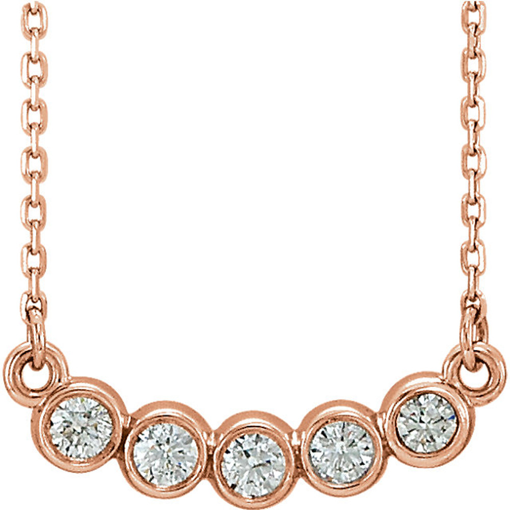 Beautiful 14Kt rose gold bezel set 1/3 ct. tw. diamond necklace hanging from a 16-18" inch chain which is included.