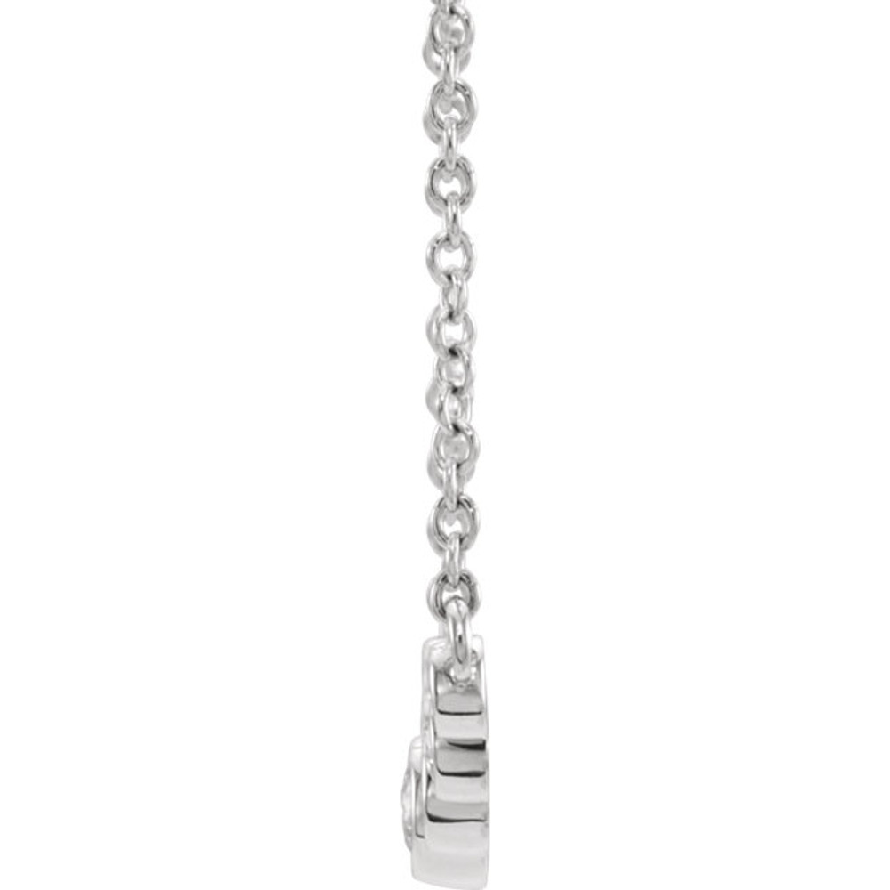 Beautiful 14Kt white gold bezel set 1/5 ct. tw. diamond necklace hanging from a 16-18" inch chain which is included.