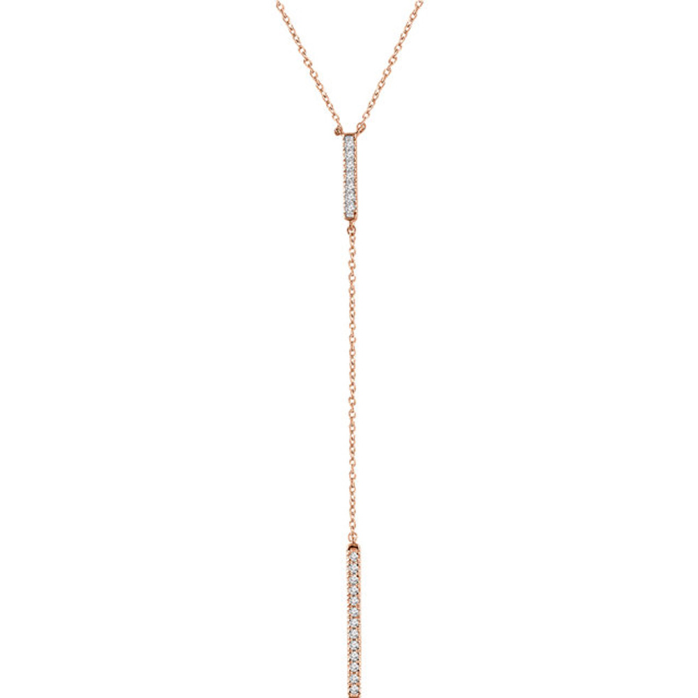 This alluring diamond bar "Y" necklace is striking. Set in 14kt rose gold with 20 shimmery diamonds weighing 1/5 ct tw, it is a perfect necklace for the perfect black dress. Don this knockout and all eyes will be on you.