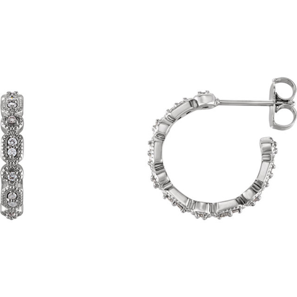 Superb style is found in these 14Kt white gold Granulated J-Hoop earrings accented with the brilliance of round full cut diamonds. Total weight of the diamonds is 1/6 carats.