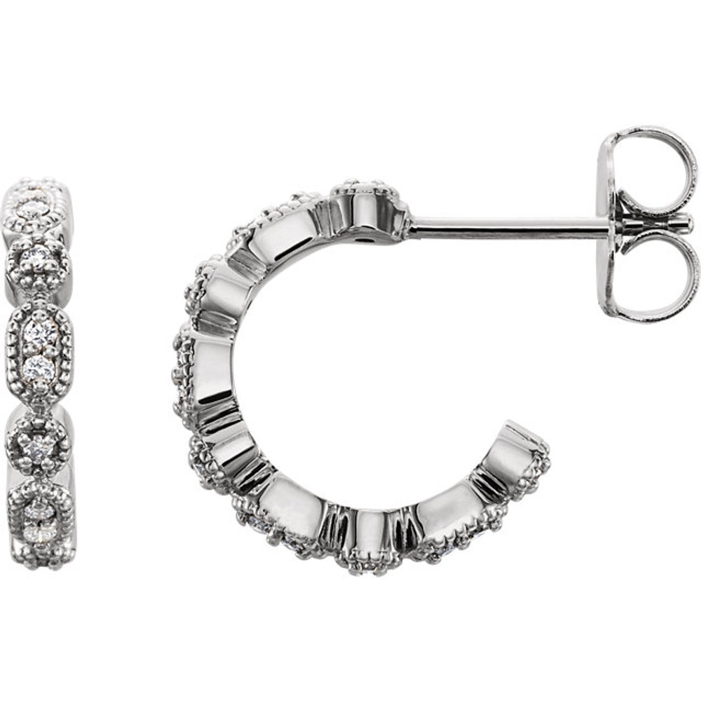 Superb style is found in these 14k white gold Granulated J-Hoop earrings accented with the brilliance of round full cut diamonds. Total weight of the diamonds is 1/8 carats.