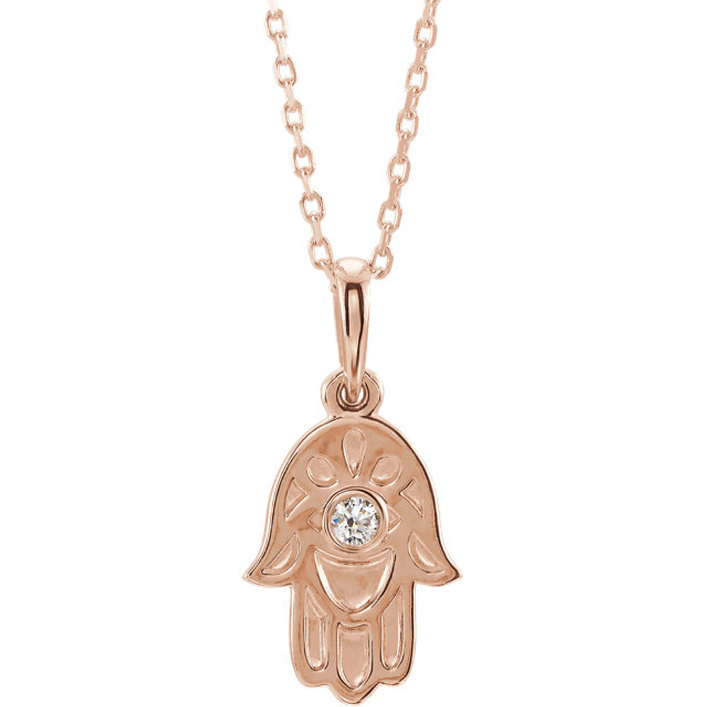 This magnificent religious-style diamond Hamsa (hand of god) necklace comes in 14k rose gold and has a bright polish to shine.

Inside this stunning hamsa pendant, an evil eye is centered with a bezel set diamond.