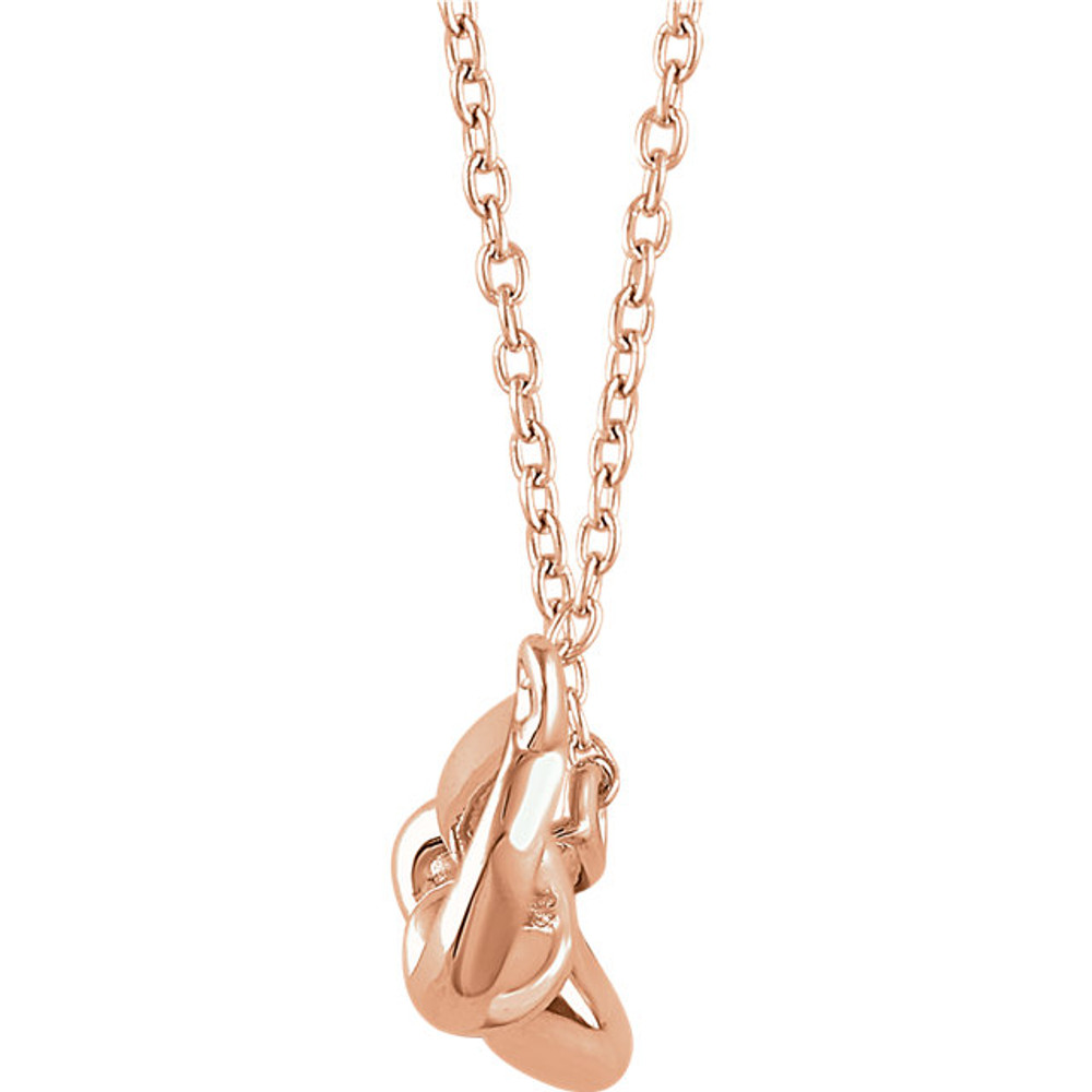 Stunning design is found in this 14Kt rose gold bow pendant hanging from a 14Kt rose gold 18" inch chain. Total weight of the gold is 1.49 grams.