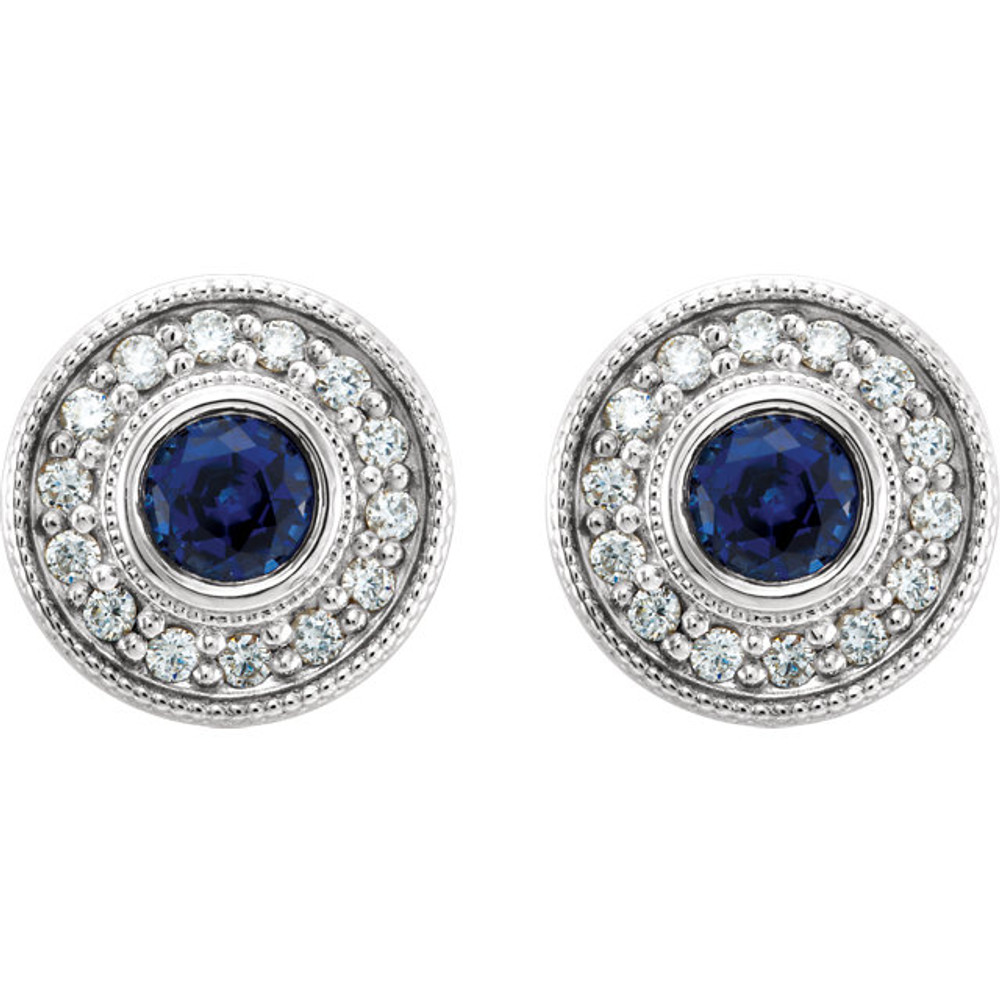 Exquisite 14Kt white gold earrings capturing the beauty of a round radiant blue sapphire in each surrounded by white shimmering diamonds.