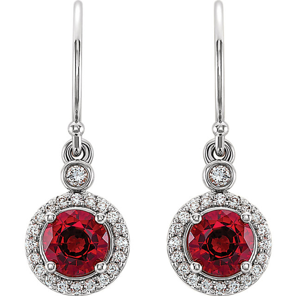 Wonderful 14Kt white gold halo-style earrings capturing the beauty of Chatham® created ruby surrounded by .08 carat total weight of white diamonds. 