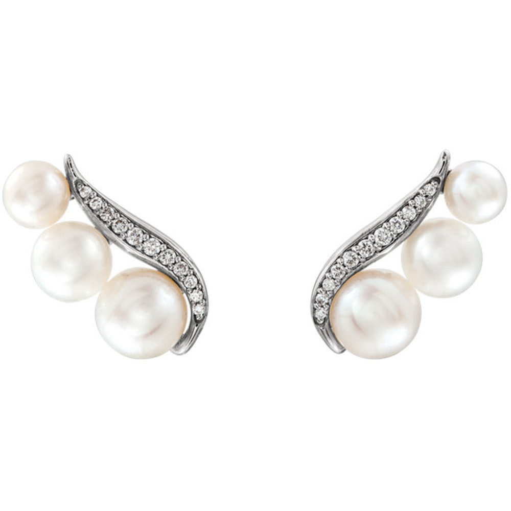 Beautiful 14Kt white gold earrings featuring 6 pearls and 1/10 carats in white diamonds. Total weight of the gold is 1.88 grams.