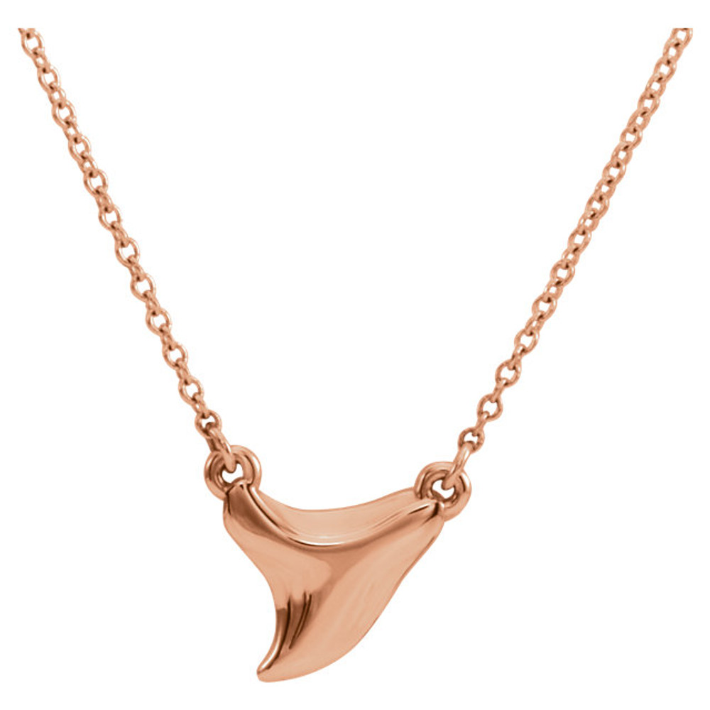 Take a bite out of style with this 14k rose gold Shark Tooth Pendant Necklace! The shark tooth charm has so many details, it looks like you could have picked it from the ocean and had is dipped in gold. Have the shark tooth pendant dangle from a 16 or 18 inch gold cable chain. Wear a shark tooth necklace this Summer as a playful ocean inspired necklace!
