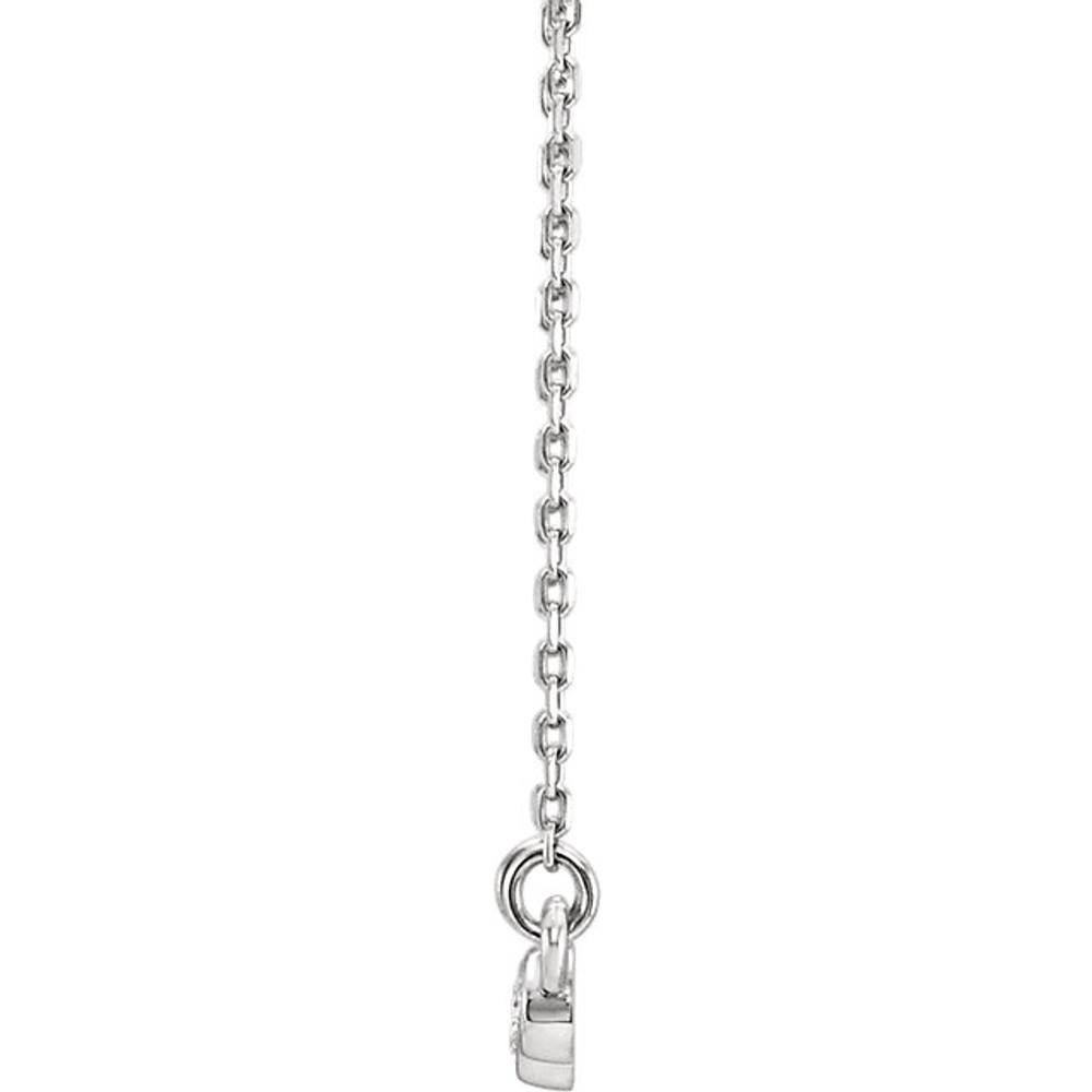 Beautiful 14Kt White gold graduated bezel set 1/8 ct. tw. diamond necklace hanging from a 16-18" inch chain which is included.