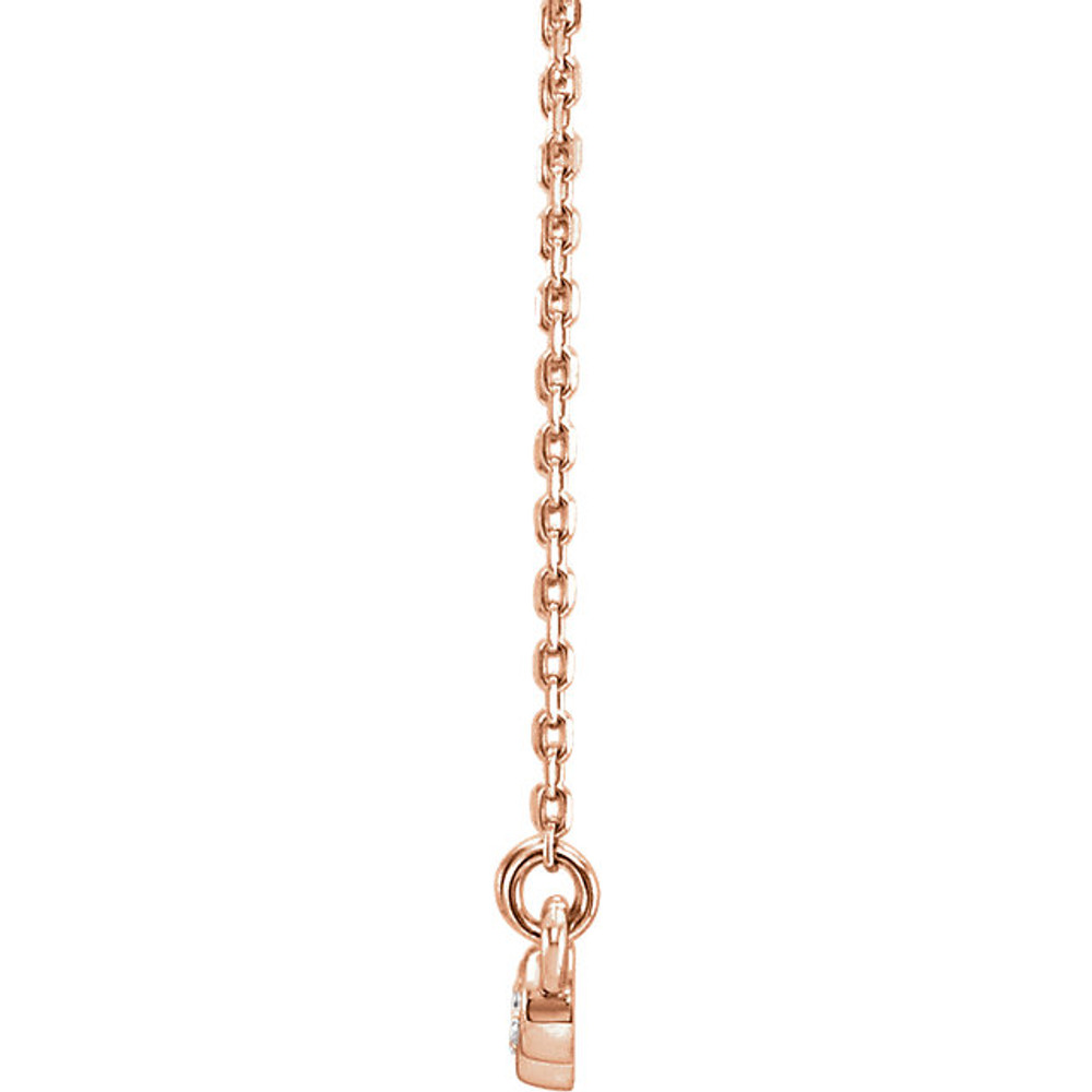 Beautiful 14Kt rose gold graduated bezel set 1/8 ct. tw. diamond necklace hanging from a 16-18" inch chain which is included.