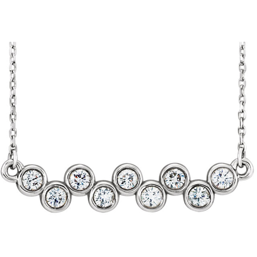 Beautiful platinum graduated bezel set 1/2 ct. tw. diamond necklace hanging from a 16-18" inch chain which is included.