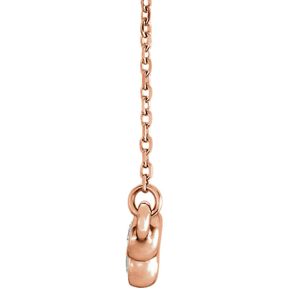 Beautiful 14Kt rose gold graduated bezel set 1/2 ct. tw. diamond necklace hanging from a 16-18" inch chain which is included.