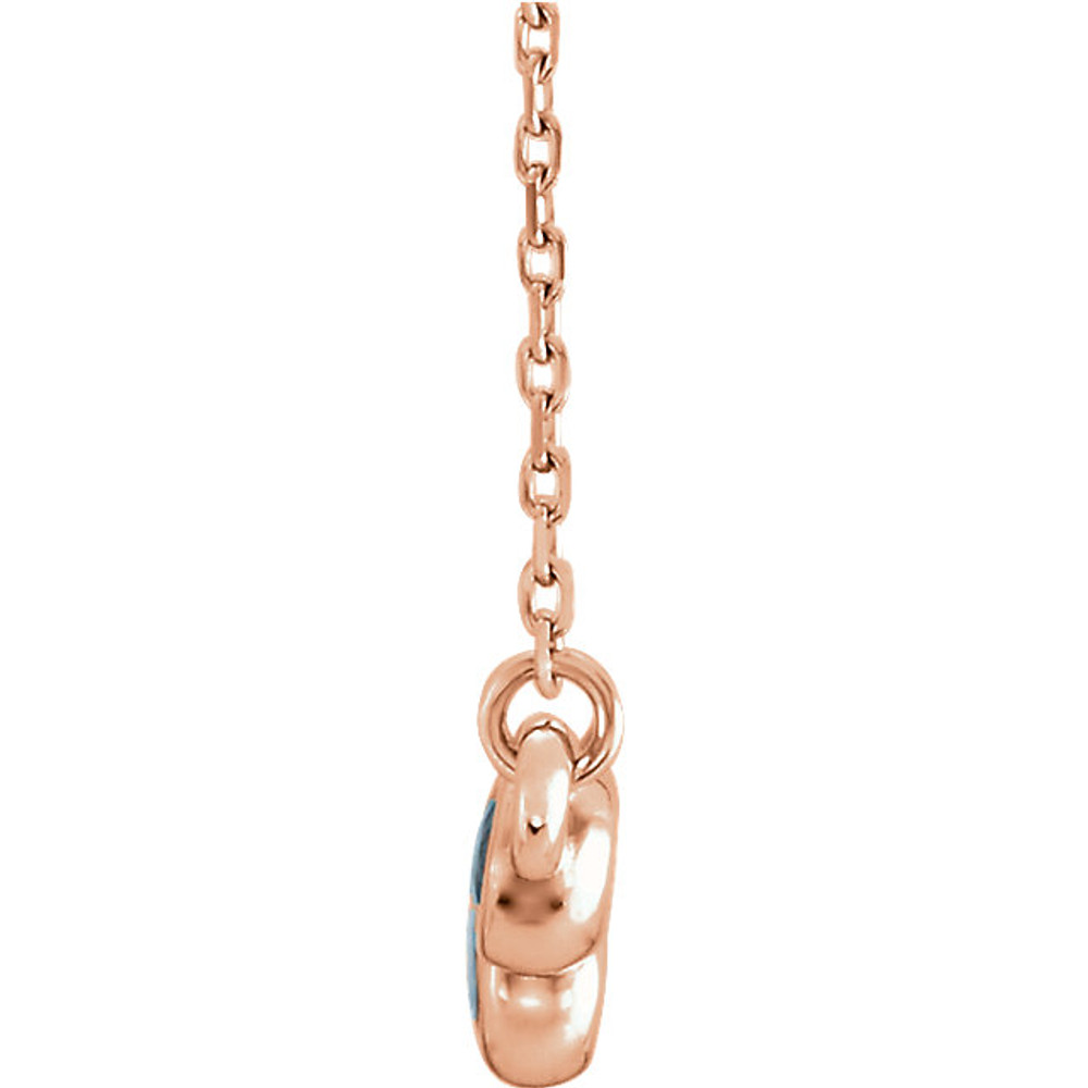 Beautiful 14Kt rose gold graduated bezel set aquamarine necklace hanging from a 16-18" inch chain which is included.