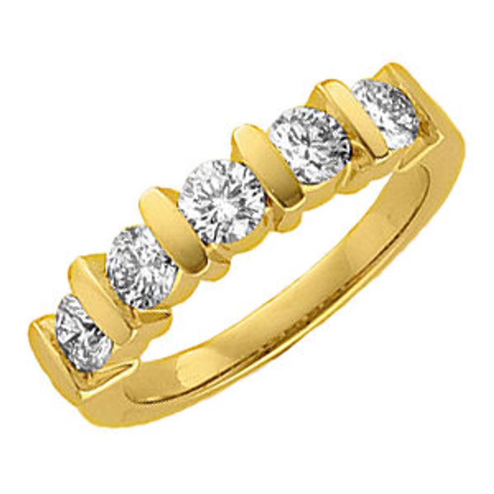 This delicate and sparkling 14k yellow gold diamond anniversary band showcases five round full cut diamonds. Diamonds are G-H or better in color and SI2 or better in clarity.