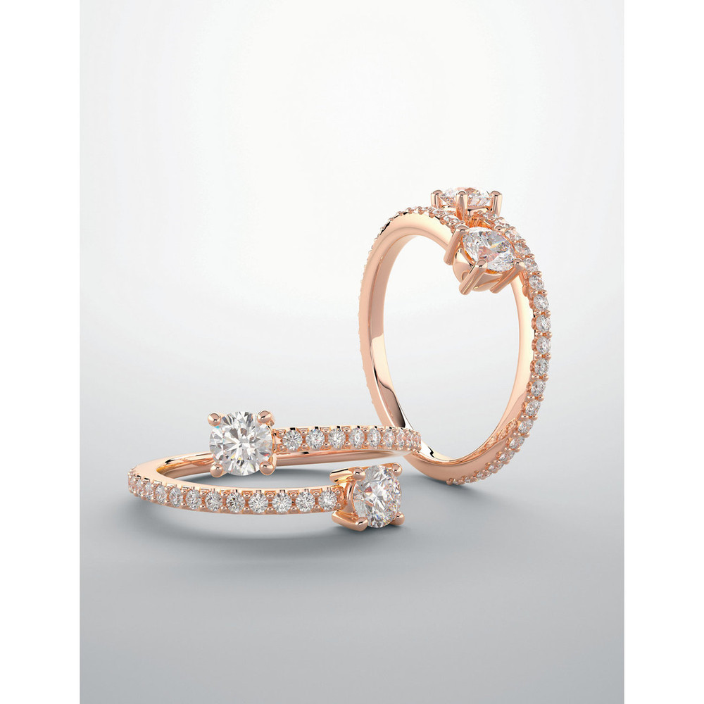 Diamond Two Stone Bypass Ring 7/8 CTW, G-H, I1 graded diamonds set in 14k rose gold. Features 2, 1/4 carat gemstones hand selected to match and set.
