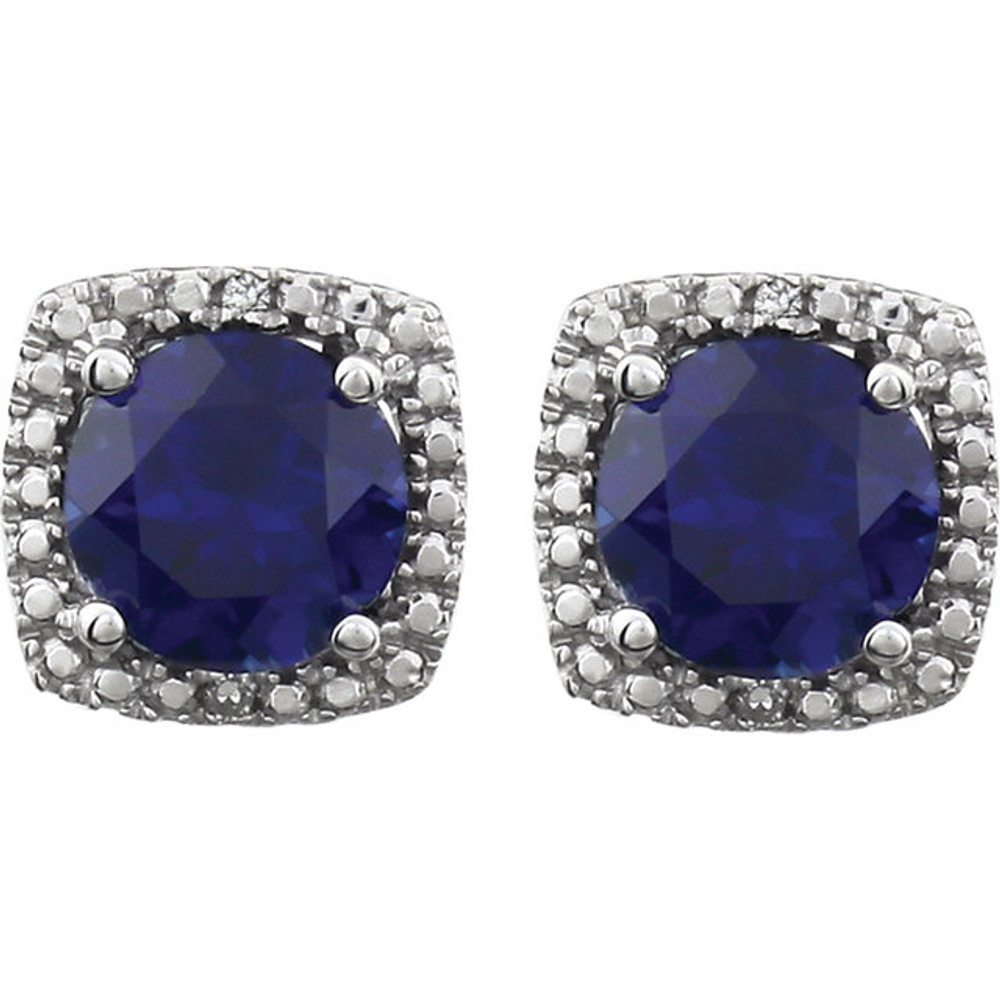 Beautiful sterling silver created blue sapphire september birthstone diamond earrings with .015 ct tw. Say "I love you" to any woman in your life; a friend, mother, wife, girlfriend, daughter. All earrings are sold in pairs. 